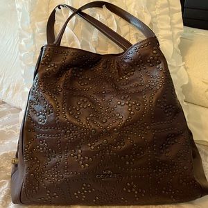 Coach bag with metal studs in Oxblood color